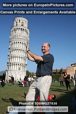 Photographer holds up the Leaning Tower of Pisa